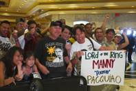 Fans wait for boxer and Filipino congressman Manny Pacquiao at the MGM Grand Tuesday, June 5, 2012. Pacquiao will defend his WBO welterweight title against undefeated boxer Timothy Bradley Jr. at the MGM Grand Garden Arena Saturday.