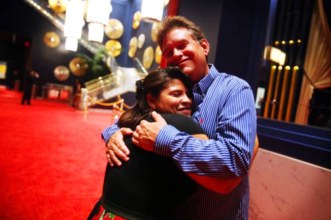 Chaparral High School principal Dave Wilson gets a hug from junior Jazzmin Jones, 17, before seeing Le Reve - The Dream at Wynn Las Vegas on Tuesday, June 5, 2012.