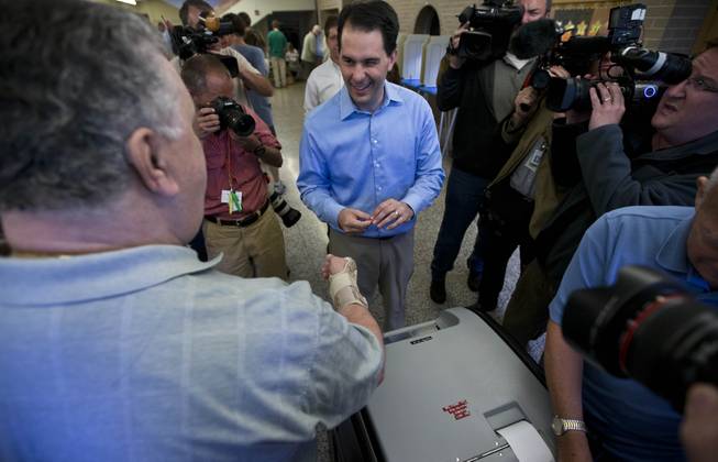 Wisconsin Republican Gov. Scott Walker casts his ballot Tuesday, June 5, 2012, in Wauwatosa, Wis. Walker faces Democratic challenger Tom Barrett in a special recall election.
