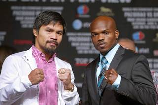 Filipino boxer Manny Pacquiao, left, and boxer Timothy Bradley Jr. pose during a news conference at the MGM Grand Wednesday, June 6 2012. Pacquiao will defend his WBO welterweight title against the undefeated Bradley at the MGM Grand Garden Arena on Saturday.