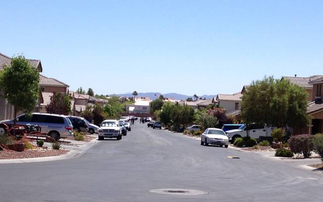 A view into the neighborhood where Metro Police located a suspect accused of fatally shooting a man Wednesday morning near Windmill Parkway and La Serna Street.