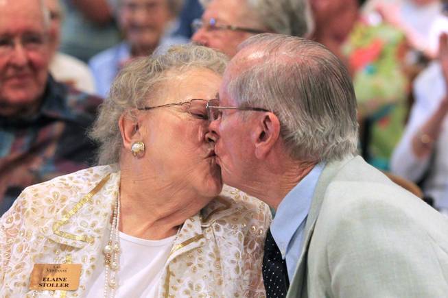 Elaine and Ron Stoller, married for 63 years, smooch at the conclusion of a wedding vow renewal ceremony at Las Ventanas Wednesday, June 6, 2012.