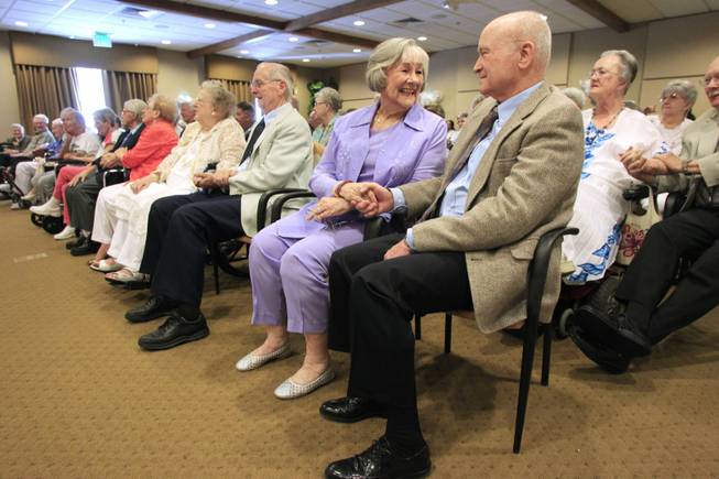Marilyn and Herb Steege hold hands during a wedding vow renewal ceremony at Las Ventanas Wednesday, June 6, 2012.