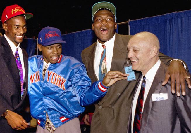 From left, former Rebels Stacey Augmon, Greg Anthony and Larry Johnson celebrate with coach Jerry Tarkanian in New York City at the 1991 NBA Draft, when all three were selected in the first round. Augmon will be inducted into the Southern Nevada Sports Hall of Fame on Friday, an honor previously bestowed upon both of his teammates and his coach.