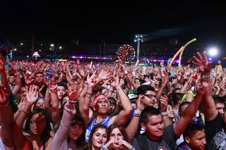 Festival-goers listen to electronic dance music at the kinetic FIELD during the final night of the Electric Daisy Carnival at the Las Vegas Motor Speedway Sunday night/Monday morning June 11, 2012.