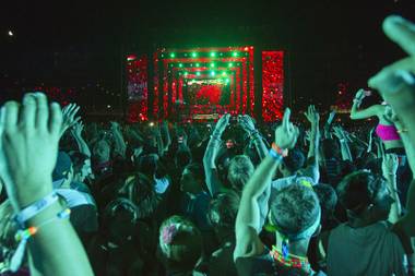 Festival-goers listen to electronic dance music by Avicii at the kinetic FIELD during the final night of the Electric Daisy Carnival at the Las Vegas Motor Speedway Sunday night/Monday morning June 11, 2012.