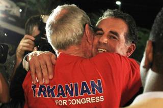 Congressional candidate Danny Tarkanian gets a congratulatory hug from a supporter at his primary election night party at Born and Raised tavern, Tuesday, June 12, 2012. Tarkanian will face Steven Horsford in the general election.