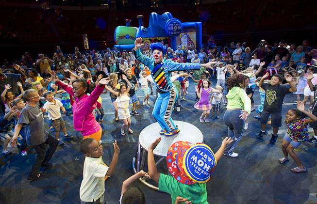 Clown Billy Murray leads children in a dance during Ringling Bros. and Barnum & Bailey pre-show at the Thomas & Mack Center Thursday, June 14, 2012. The circus will perform through Sunday.