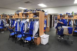 Las Vegas 51s clubhouse manager Steve Dwyer begins the process of sorting, folding and putting away laundry Friday, June 15, 2012.