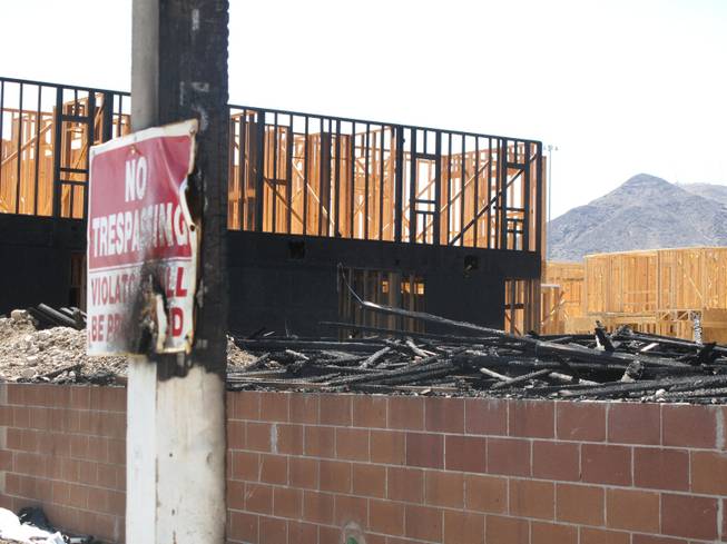 Signs near Wigwam Street were scorched by an early morning fire at an apartment construction site. Fire crews responded to an early morning fire at 1131 Wigwam St., the future site of Theory Apartments on Wednesday , June 20, 2012.