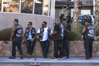 Members of the Mongols Motorcycle Club stand guard outside the Boulder City Inn and Suites as they hold their annual convention in Boulder City Saturday, June 23, 2012.