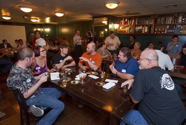 Patrons chat during a monthly cask beer event at the Freakin' Frog Cafe & Beer Bar, 4700 S. Maryland Parkway, Monday, June 25, 2012.