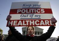 Amy Brighton from Medina, Ohio, who opposes health care reform, rallies in front of the Supreme Court  in Washington, Tuesday, March 27, 2012, as the court continues arguments on the health care law signed by President Barack Obama. 