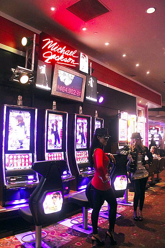 Victoria Falcon (in red) and Cecilia Isberg (in black) donned Michael Jackson costumes July 7, 2012, at Treasure Island to help Bally promote a new slot machine themed after the King of Pop. The Michael Jackson slot just began hitting the Las Vegas casinos within the past two weeks.