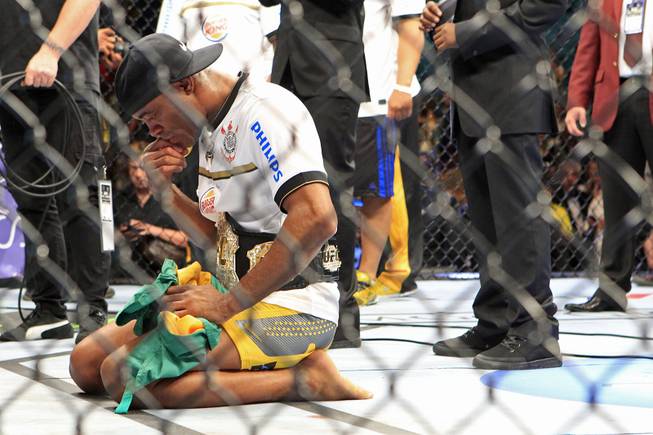 Anderson Silva says a prayer after defeating Chael Sonnen in their bout at UFC 148 Saturday, July 7, 2012 at the MGM Grand Garden Arena.