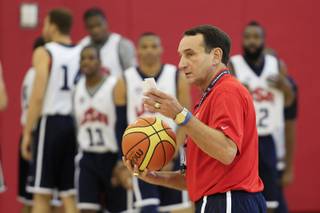 Team USA basketball coach Mike Krzyzewski talks to his team before practice Tuesday, July 10, 2012 at UNLV's Mendenhall Center.