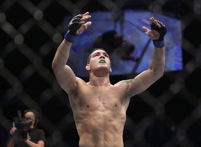 Chris Weidman celebrates after beating Mark Munoz in a UFC on Fuel 4 Mixed Martial Arts middleweight bout in San Jose, Calif., Wednesday, July 11, 2012. Weidman won in the second round. 