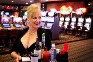 June Drao serves cocktails on the casino floor at Sam's Town in Las Vegas on Tuesday, July 17, 2012. Drao has worked as a cocktail server at Sam's Town for 27 years.