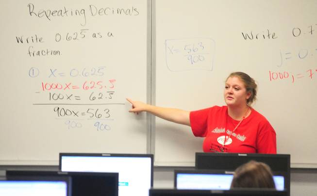 Tutor Megan Bavaro teaches a math concept at UNLV's Summer Bridge program on Tuesday, July 17, 2012. The new program helps incoming freshmen avoid costly remedial math courses by preparing them for five weeks over the summer to pass a math proficiency exam that places them into a college-level math course.