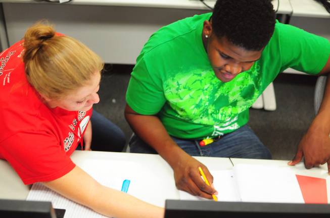 Tutor Megan Bavaro helps Sevaughn Thomas, 18,  at UNLV's Summer Bridge program on Tuesday, July 17, 2012. The new program helps incoming freshmen avoid costly remedial math courses by preparing them for five weeks over the summer to pass a math proficiency exam that places them into a college-level math course.