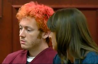 In this image taken from video provided by KUSA.com, James Holmes, left, the suspected gunman in Friday's Colorado theater massacre, makes his first appearance in court with his attorney in Aurora, Colo., Monday, July 23, 2012. 