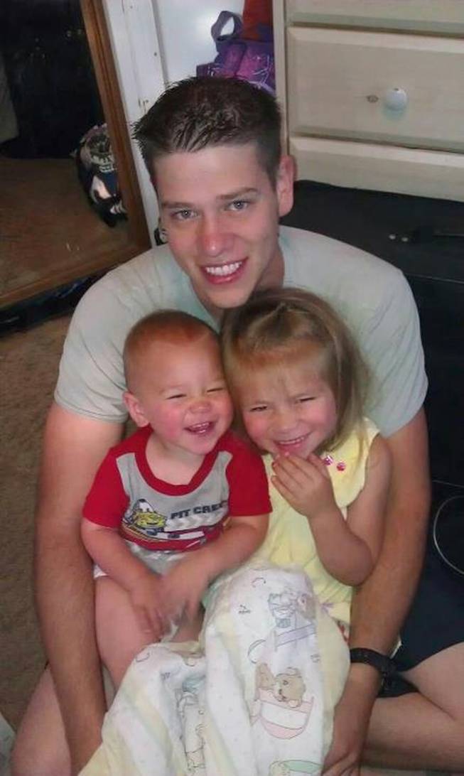 This undated photo provided by the family shows Jonathan T. Blunk, 26, of Aurora, Colo. with his two children. Blunk was one of the victims in the Friday, July 20, 2012 Aurora, Colo. movie theater shooting.