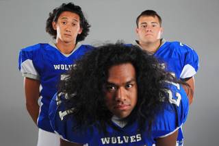 Basic football players Anthony Owens, Mike Roberts and Ian Bates Thursday, July 26, 2012.