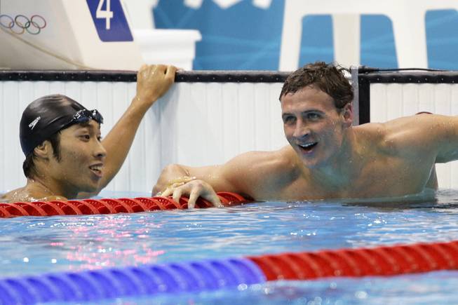 United States' Ryan Lochte and Japan's Kosuke Hagino, left, at the Aquatics Centre in the Olympic Park during the 2012 Summer Olympics in London, Saturday, July 28, 2012. 