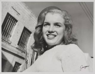 In this 1946 file image taken by photographer Joseph Jasgur and released by Julien's Auctions, Norma Jean Dougherty, who eventually changed her name to Marilyn Monroe, is shown. Copyrights and images from Marilyn Monroe's first photo shoot sold for $352,000 at Julien's Auctions after a bankruptcy judge in Florida ruled that photos taken of Monroe were to be sold at auction in Dec. 2011 to settle the debts of the photographer.