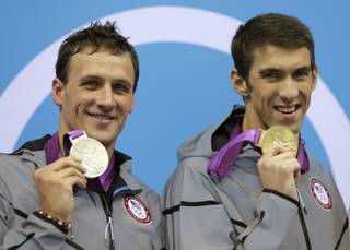 United States' Michael Phelps, right, and United States' Ryan Lochte pose with their medals for the men's 200-meter individual medley swimming final at the Aquatics Centre in the Olympic Park during the 2012 Summer Olympics in London, Thursday, Aug. 2, 2012.  