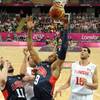 The United States' forward Andre Iguodala, center and Kevin Love, left, vie for the ball with Tunisia's center Salah Mejri, right, during their men's preliminary round group A basketball match at the 2012 Summer Olympics on Tuesday, July 31, 2012, in London. 