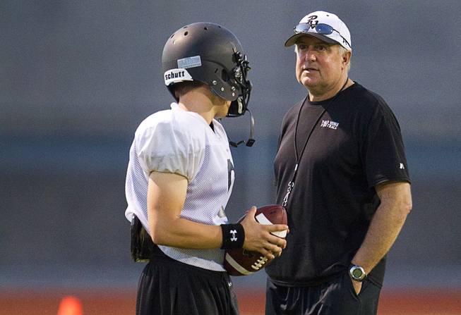 Palo Verde High School's Parker Rost talks to his father, coach Darwin Rost during practice at the school Tuesday, Aug. 7, 2012. Palo Verde will face Desert Vista High School (Arizona) in the Sollenberger Classic at the University of Phoenix Stadium in Arizona on Aug. 18.
