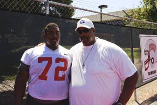 UNLV sophomore Ron Scoggins Jr. with his father Ron Sr. after a UNLV practice.