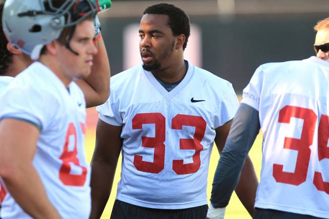 UNLV running back Dionza Bradford takes a break during practice Tuesday, August 7, 2012.