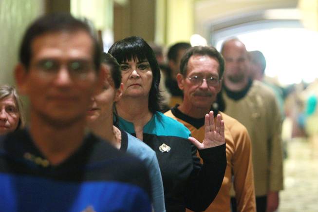 Attendees wait to enter the theater for during an attempt to set the Guinness world record for most people in Star Trek costumes Saturday, August 11, 2012 at the Star Trek convention at the Rio.