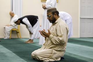 Aslam Abdullah, director of the Islamic Society of Nevada, prays on the 27th day of Ramadan at the Jamia Masjid mosque Wednesday, Aug. 15, 2012. During the month of Ramadan, Muslims fast from dawn until sunset.
