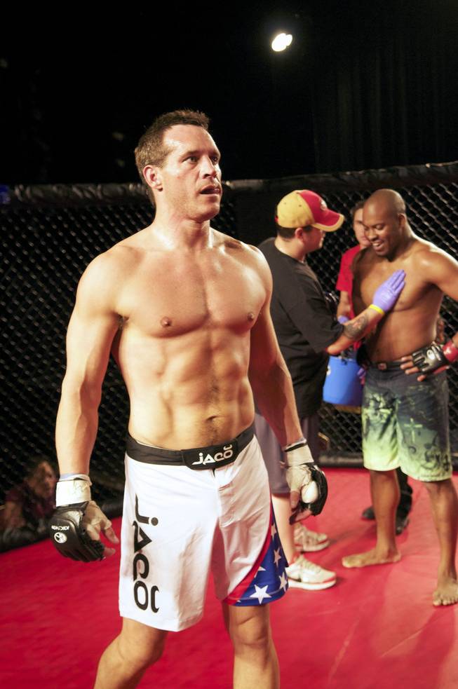 Nevada Secretary of State Ross Miller (left)  had his first official MMA competition against Jamal Williams (right) winning in the 2nd round after delivering a body kick and a hard right Saturday, Aug. 18, 2012.