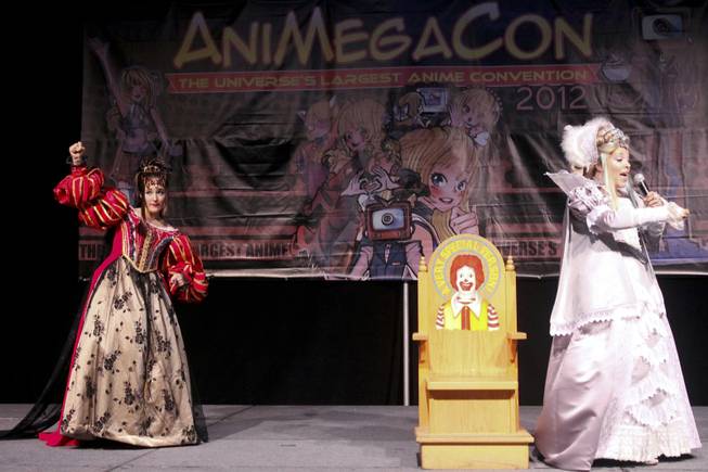 Announcers in cosplay take the stage during a Masquerade competition interlude at Animegacon 2012 at LVH on Saturday, Aug. 18, 2012.