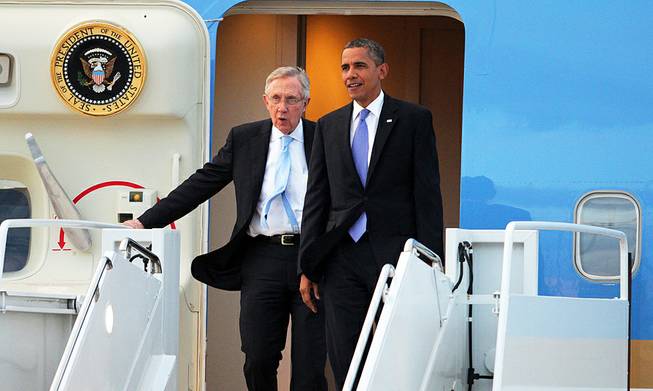 President Barack Obama and Senate Majority Leader Harry Reid arrive at Nellis Air Force Base on Tuesday, Aug. 21, 2012.