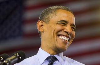 President Barack Obama smiles as he prepares to speak at a rally at Canyon Springs High School in North Las Vegas Wednesday, Aug. 22, 2012.