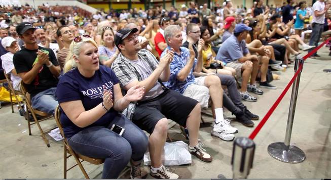 Ron Paul supporters applaud a speaker at the P.A.U.L. Fest expo Saturday, Aug. 25, 2012, at the Florida State Fairgrounds.