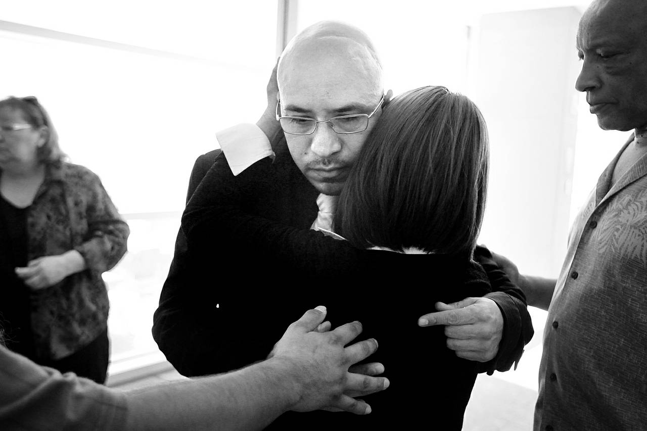 Arturo Martinez-Sanchez is consoled by his family and friends Aug. 27, 2012, after attending a Bryan Clay hearing at the Regional Justice Center in Las Vegas. Clay is the accused killer of Martinez-Sanchez’s wife and daughter.
