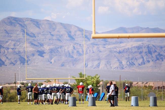 Canyon Springs football players go through an early season practice.