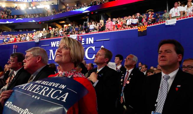 Nevada delegate Kim Bacchus and Lieutenant Governor Brian Krolicki look on during Mitt Romney's speech to the Republican National Convention Thursday night Aug. 30, 2012 in Tampa.