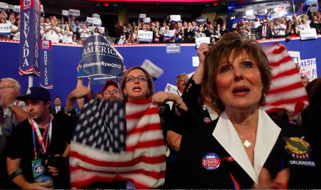 Women from the Oklahoma delegation, across the aisle from Nevada's, join in a "Mitt, Mitt, Mitt" cheer during Mitt Romney's speech at the Republican National Convention Thursday night on Aug. 30, 2012.