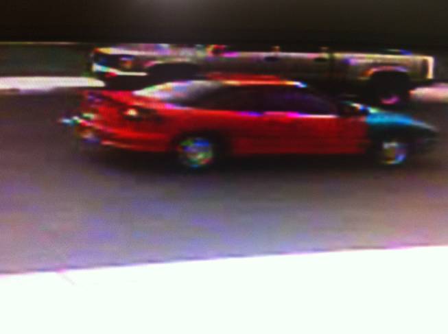 Police say suspects in a kidnapping in Henderson fled in this red, late model, two-door passenger car with a blue fender on the front passenger side.