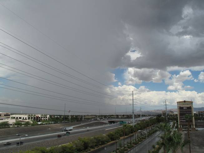Storm clouds loom over Henderson after a rainstorm, Friday, Aug. 31, 2012.