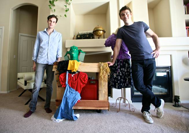 Spencer Novich (left) and Brett Alters pose with props and costumes for their original production "Two Little Girls in the Bayou." The pair used the crowd-funding website Kickstarter to raise $10,000 for the production. 