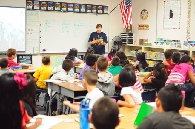 Decker Elementary School teacher Kim Jeter reads to a 51-student fourth-grade class on Wednesday, Sept. 5, 2012. The air-conditioning system at the nearby Diskin Elementary school, a 39-year-old school that was last renovated 13 years ago, failed on Tuesday, prompting school officials to temporarily close the school and transfer Diskin students to Decker on Wednesday.