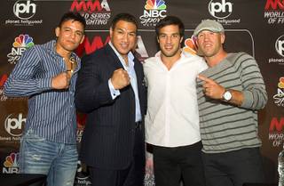 World Series of Fighting league president Ray Seto, second left, poses with fighters during a news conference at the Planet Hollywood Live theater (formerly the Theatre for the Performing Arts) at Planet Hollywood Thursday, Sept. 6, 2012. From left are: Miguel Torres, Seto, Gregor Gracie, and Josh Burkman. The new league will debut with a fight card broadcast on NBC at the theater on Nov. 3.